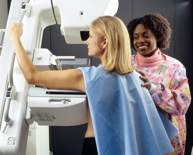 A woman patient during her breast cancer screening test, mammogram by her doctor, Breast Cancer Test Darwin